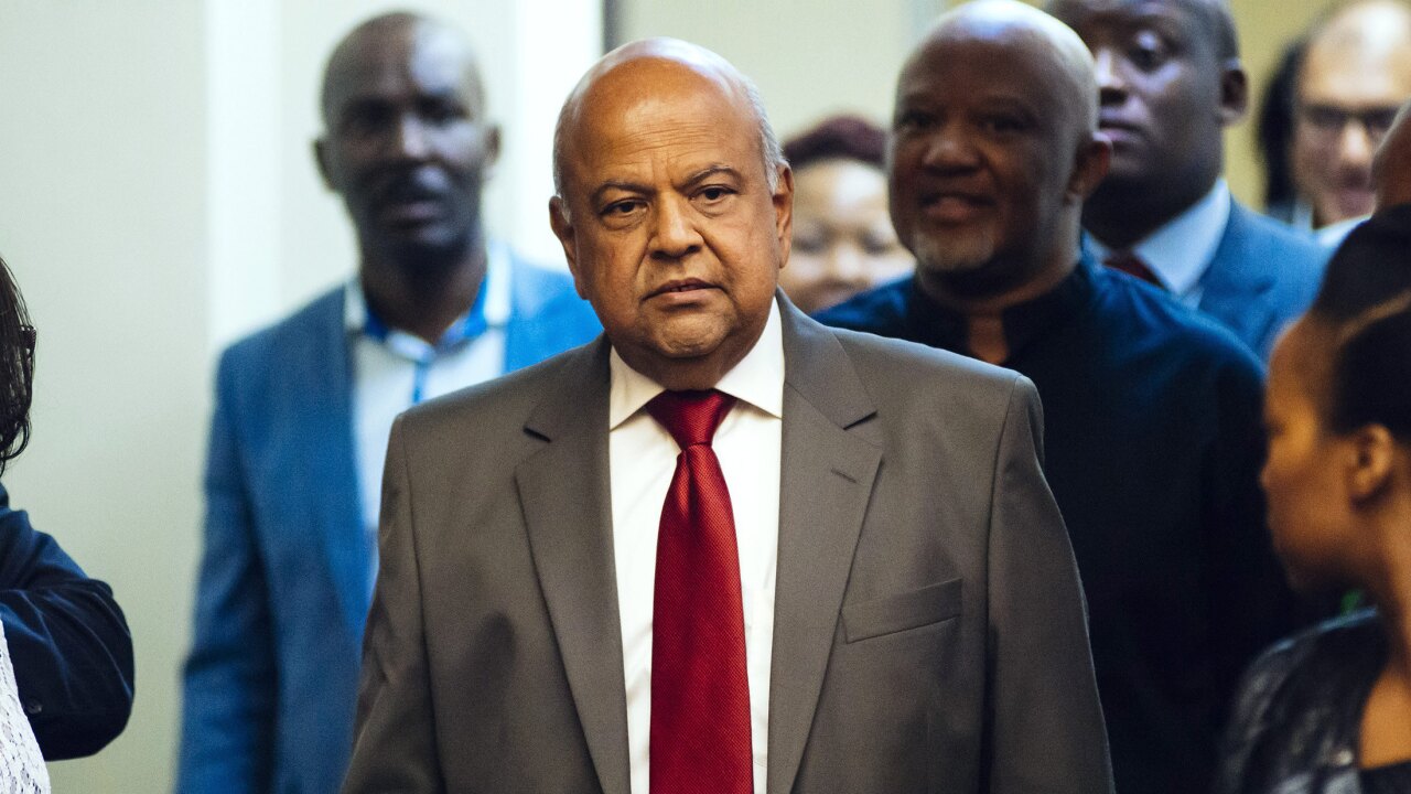 Pravin Gordhan, former South African finance minister, arrives for a news conference in Pretoria.