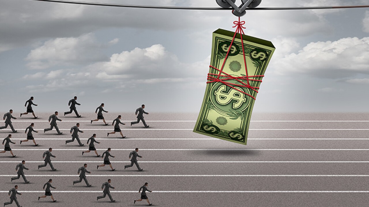 Image showing people on a track chasing after a stack of money pulled along in front of them.