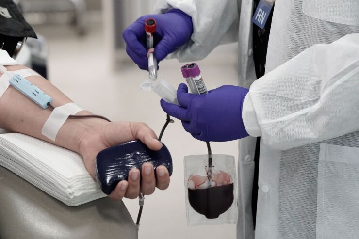 Blood is drawn from a donor during a blood drive.