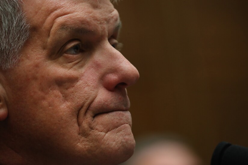 Tim Sloan, president and chief executive of Wells Fargo, waits for the start of a House Financial Services Committee hearing in Washington on March 12, 2019.
