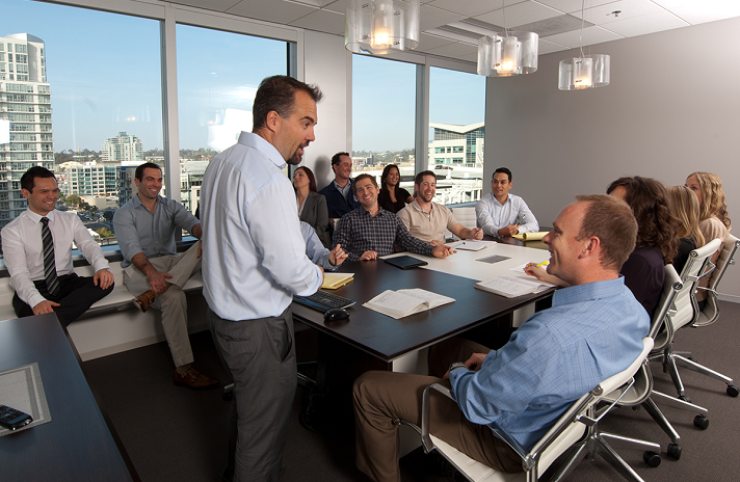 Mortgage Capital Trading employees in a boardroom