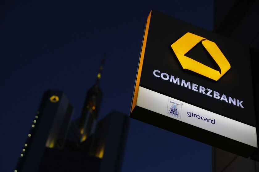 The Commerzbank logo sits illuminated on an ATM sign outside a branch near the bank's headquarters in Frankfurt, Germany, on June 29, 2020.