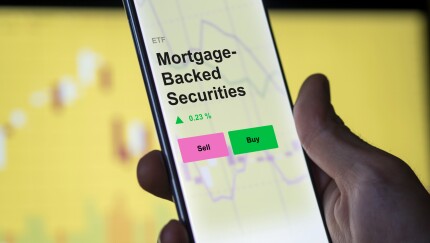 An investor's analyzing the mortgage-backed securities etf fund