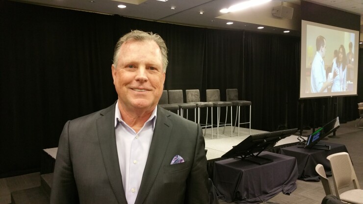 John Janclaes, pictured during a 2017 credit union conference near Seattle