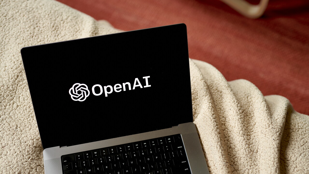 A picture of a computer with the OpenAI logo on the screen.