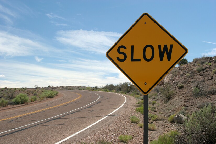 slow road sign