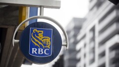 Small signage is displayed outside of a Royal Bank of Canada (RBC) branch during the company's annual general meeting in Toronto, Ontario, Canada, on Thursday, April 6, 2017