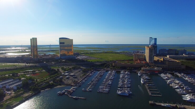 The Borgata Hotel Casino & Spa, from left, The Water Club, The Golden Nugget Inc., and Harrah's Waterfront Towers stand in this aerial photograph taken above Atlantic City, New Jersey, U.S., on Monday, July 11, 2016.