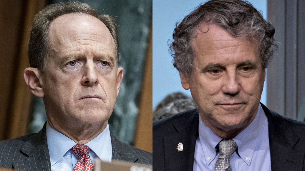 Republican Sen. Pat Toomey, left, said "financial regulation and supervision isn’t meant for advancing environmental policy." Democrat Sherrod Brown disagreed. "Climate change threatens the country’s financial stability,” he said.