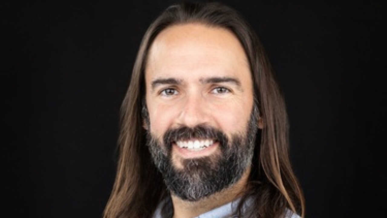 Headshot of Daniel Herrington.