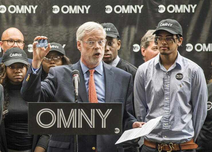 MTA chairman Patrick Foye, at lectern, announcing the launch of the OMNY fare payment system on May 31, 2019.