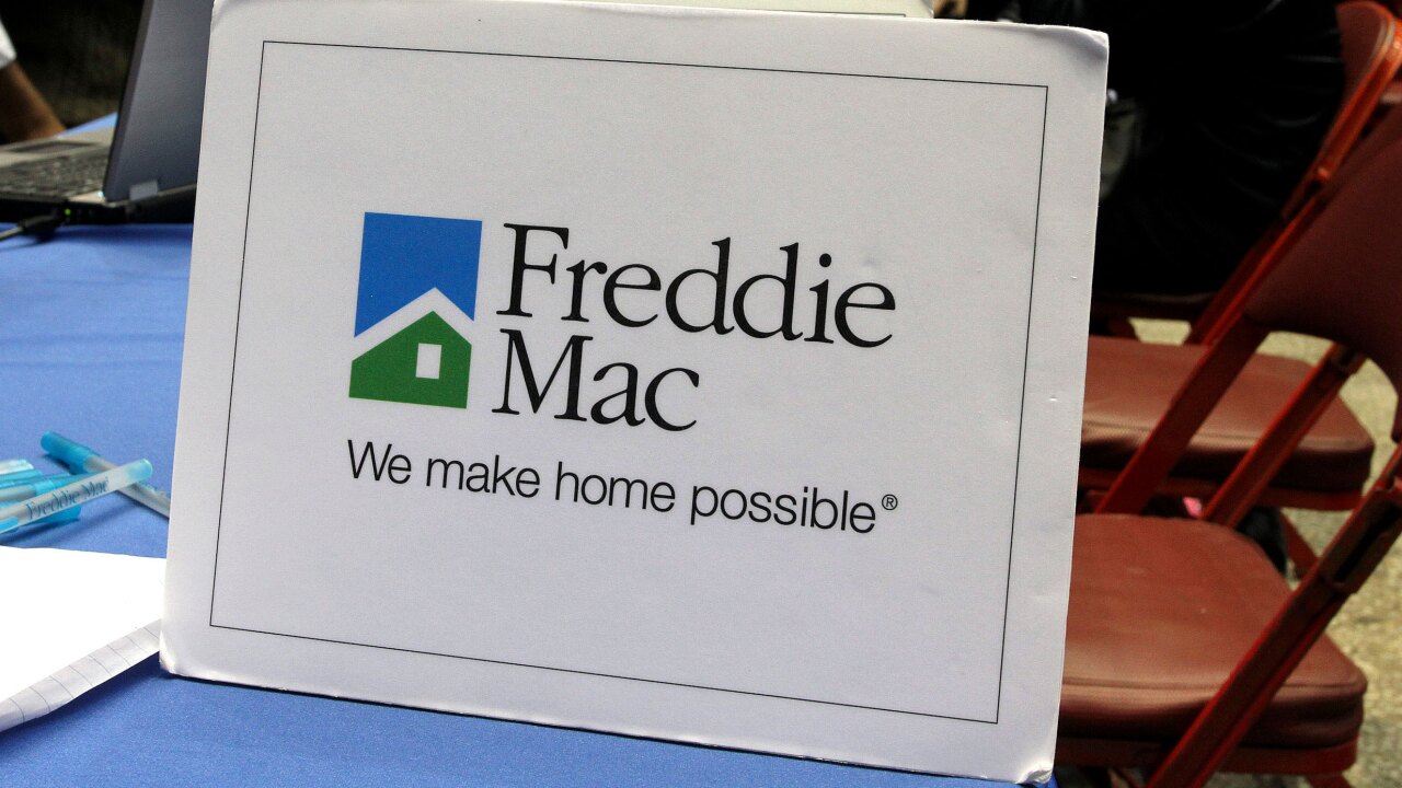 Freddie Mac signage is displayed at the Neighborhood Assistance Corp. of America's "Save-the-Dream Tour" at the Los Angeles Sports Arena in 2011.