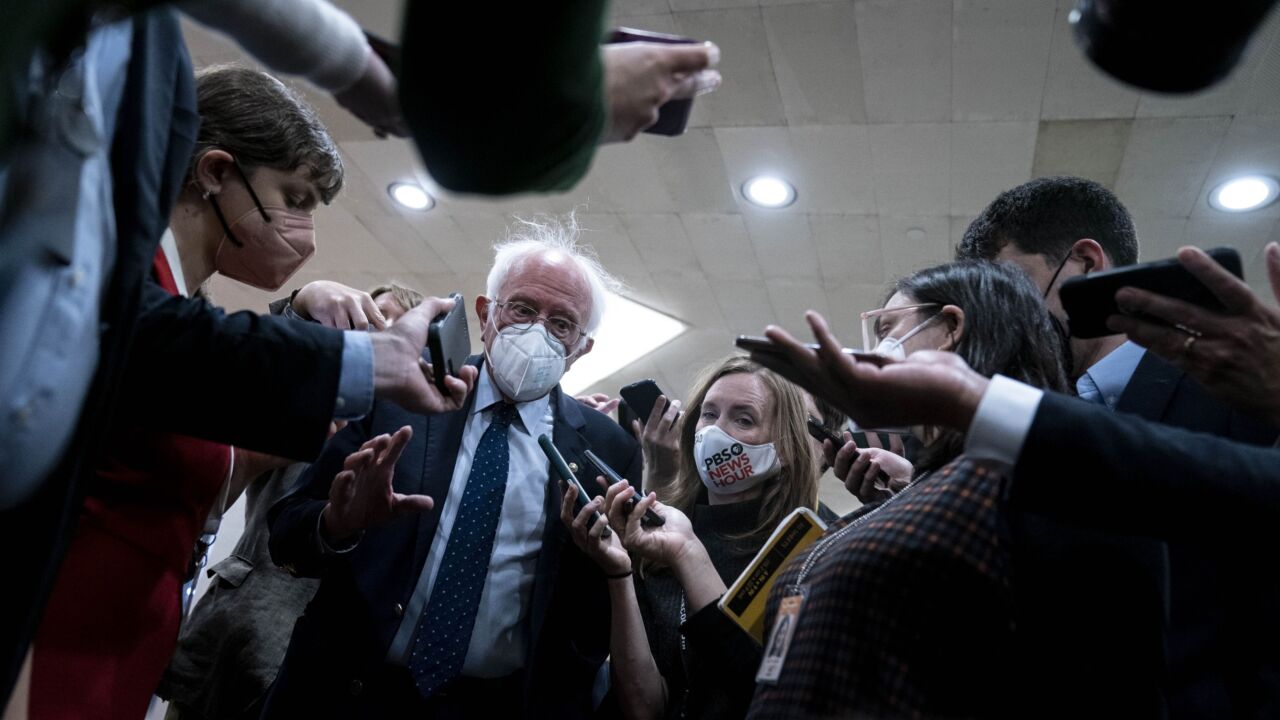 sanders-bernie-senate-masked-reporters.jpg