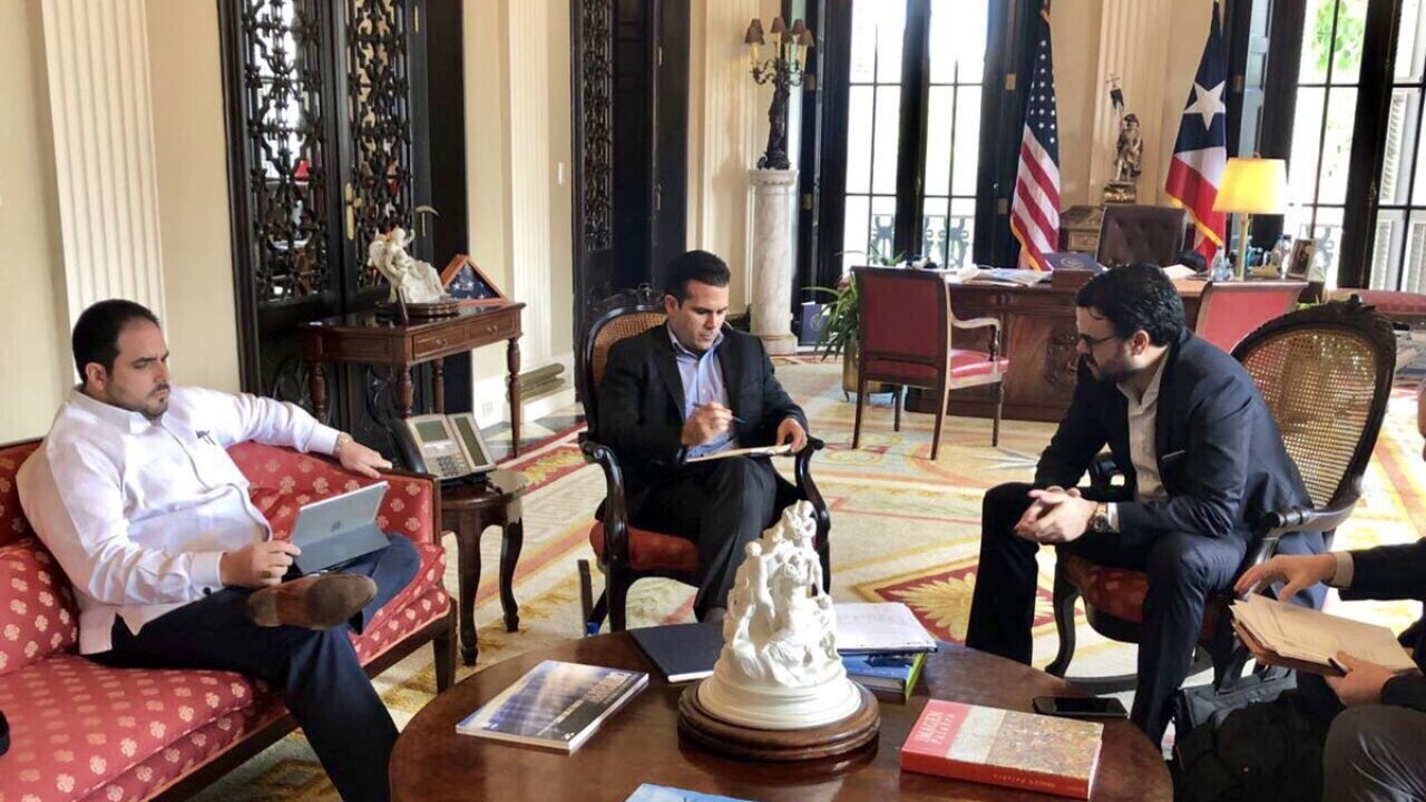 Ricardo Rossello, Gerardo Portelo Franco, and Christian Sobrino discuss revising Puerto Rico's fiscal plan in February 2018.