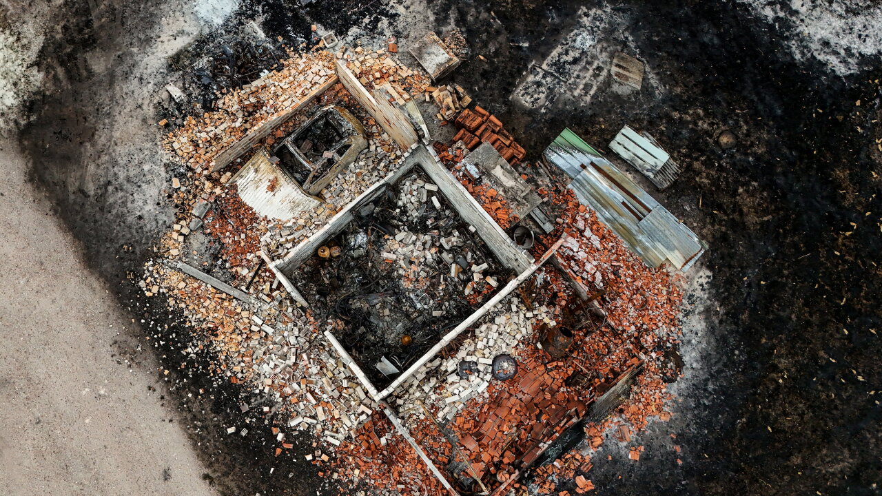 An aerial view of a burned structure.