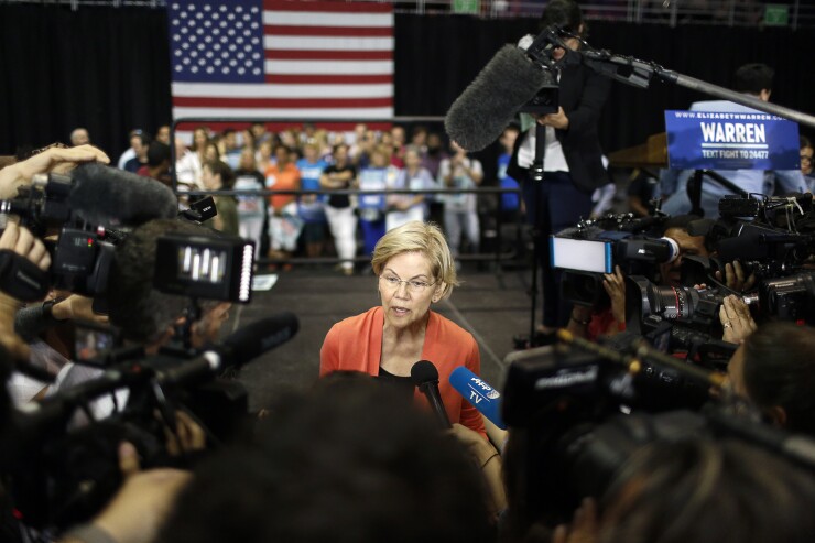 Senator Elizabeth Warren, a Democrat from Massachusetts and 2020 presidential candidate, speaks with members of the media during a town hall event in Miami, Florida, U.S., on Tuesday, June 25, 2019. Warren warned that the U.S. needs to secure its elections and says she has a plan to do that. Photographer: Marco Bello/Bloomberg