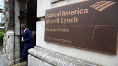 Man walking past entrance Bank of America Merrill Lynch in London Oct. 9, 2014 Bloomberg News