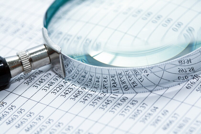 Magnifying glass image on columns of numbers