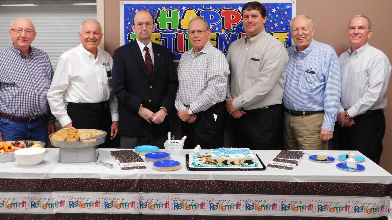Retirement party for Bob Downs, CEO at Crane Credit Union in Odon, Ind. Pictured above, from left to right, are: David Frye, director; Kenny Greenwell, director; Gary Gray, chairman of the board; Bob Downs, Crane Credit Union outgoing president/CEO; Kevin Sparks, current Crane Credit Union president/CEO; Dale Padgett, director; and Bruce Cummings, director.