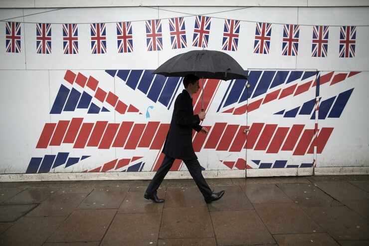 Brexit-umbrella-man-and-flags-Bloomberg