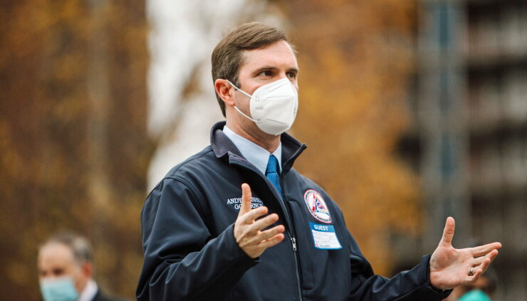 Andy Beshear, governor of Kentucky, speaks to members of the media outside the University Of Louisville Hospital in Louisville, Kentucky, U.S., on Monday, Dec. 14, 2020, the day the first COVID-19 vaccine shots were administered by U.S.