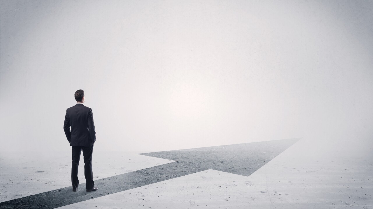 Man standing on forward arrow