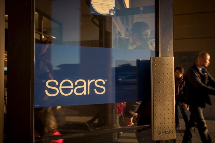 Customers enter a Sears store in San Bruno, California.