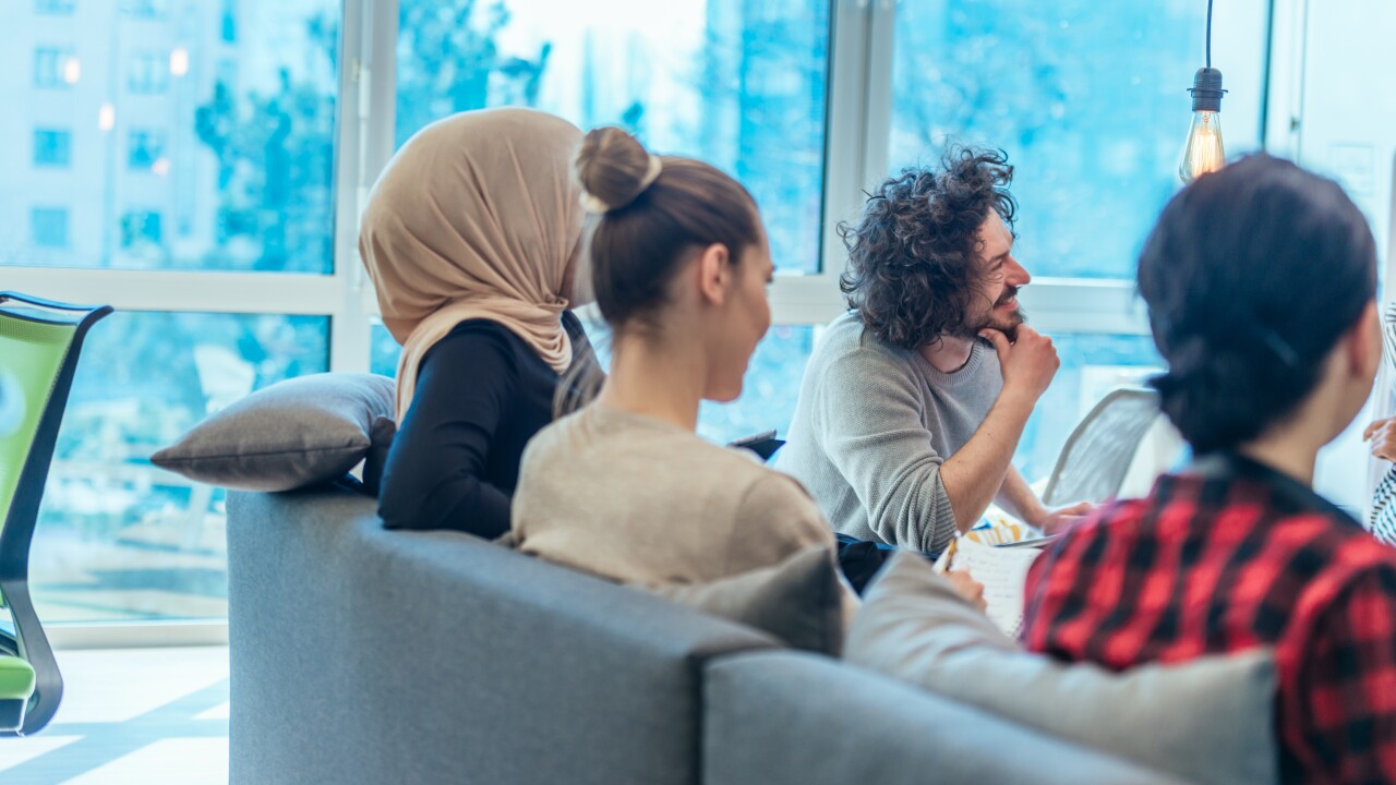 Group of employees hanging out at work
