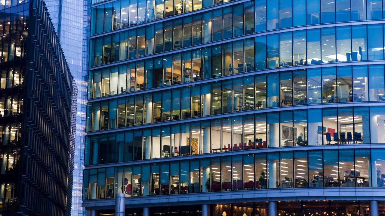 Looking into offices of two buildings.