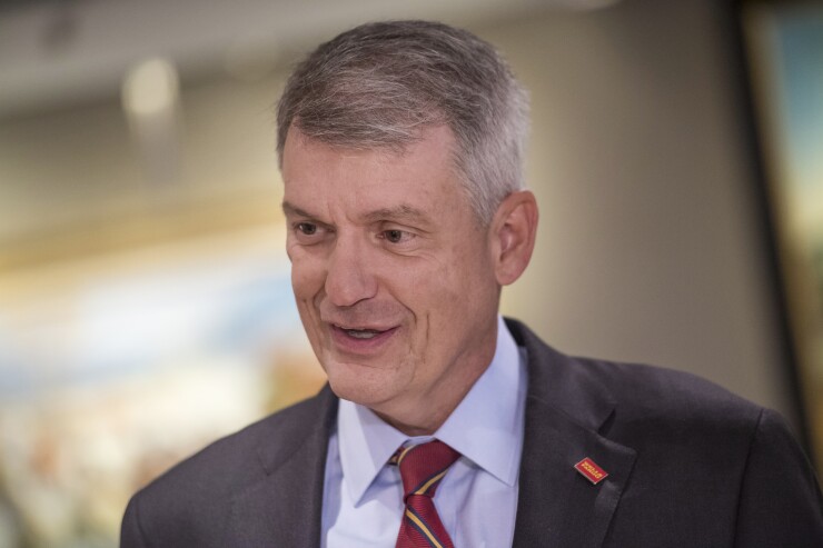 Tim Sloan, CEO of Wells Fargo, speaks with a reporter before a Bloomberg Television interview in San Francisco, May 23, 2017