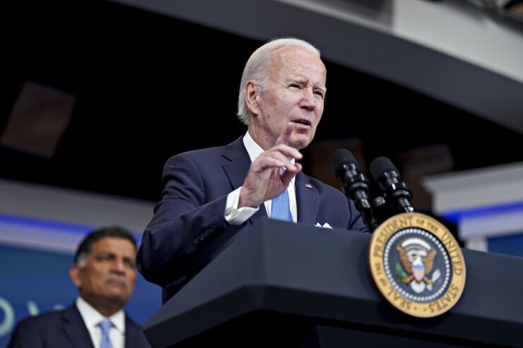 US President Joe Biden speaks before receiving a booster dose of the Covid-19 vaccine targeting the Omicron BA.4/BA.5 subvariants in the Eisenhower Executive Office Building in Washington, DC, US, on Tuesday, Oct. 25, 2022.