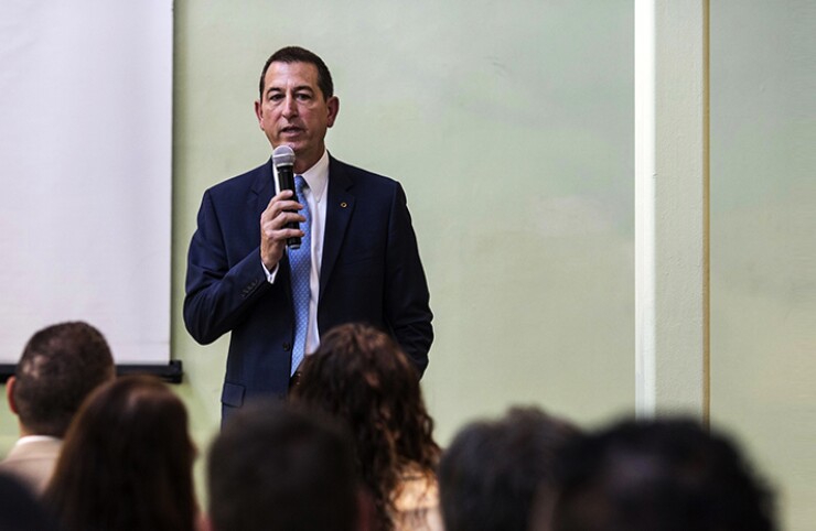 Comptroller of the Currency Joseph Otting speaks to attendees of a bus tour organized to highlight Community Reinvestment Act supported projects in the Jamaica, Queens neighborhood of Queens, NY, U.S., on Wednesday August 21, 2019. The tour highlighted challenges in low to moderate income neighborhoods for bankers, activists, and non profit workers.