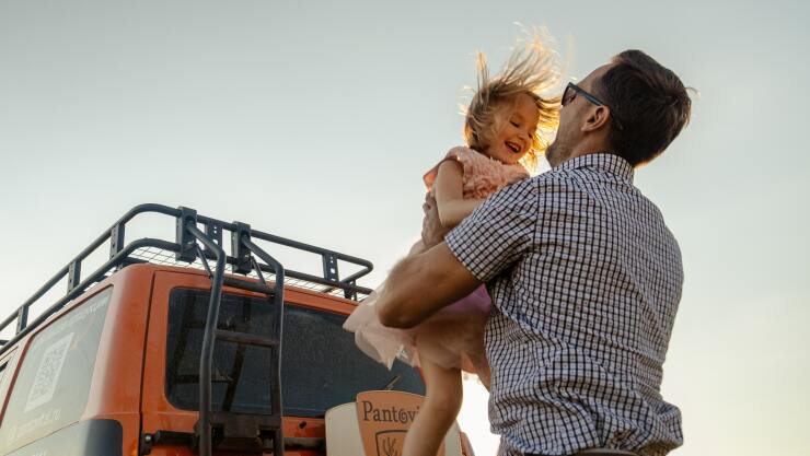 father holding daughter