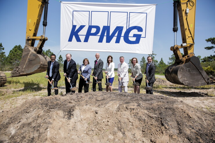 Florida Governor Rick Scott and KPMG CEO Lynn Doughtie break ground on KPMG's new training facility in Orlando