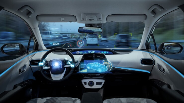 Interior view of an autonomous car dashboard.