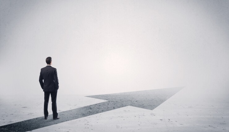 Man standing on forward arrow
