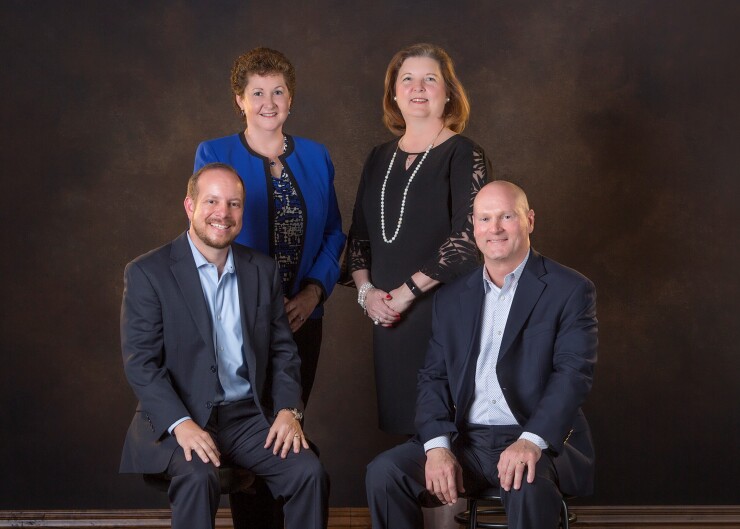 On a hot recruiting streak, Stifel picked up a new team for a branch in McAllen, Texas that opened in January. From left to right: Jonathan Montgomery, Sharon Cavazos, Teresa Hunter, and Jerry Raders.