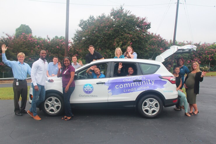 Team members from Charlotte Metro Federal Credit Union’s main office show their credit union spirit.