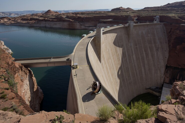 The Glen Canyon Dam stands on Lake Powell in Page, Arizona, U.S., on Thursday, June 25, 2015, when severe drought left Lake Powell at 45% of capacity.