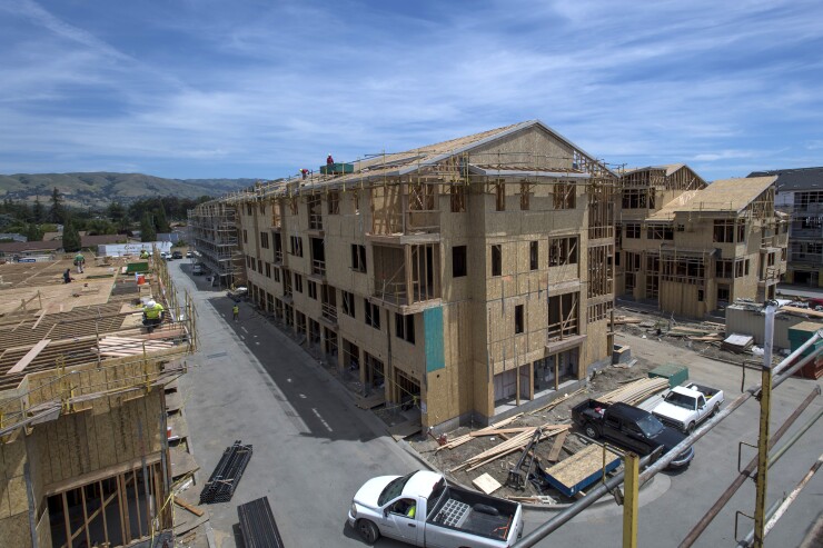 Contractors work on a townhouses under construction at the PulteGroup Inc. Onyx housing development in San Jose, California, U.S., on Wednesday, May 10, 2017. 