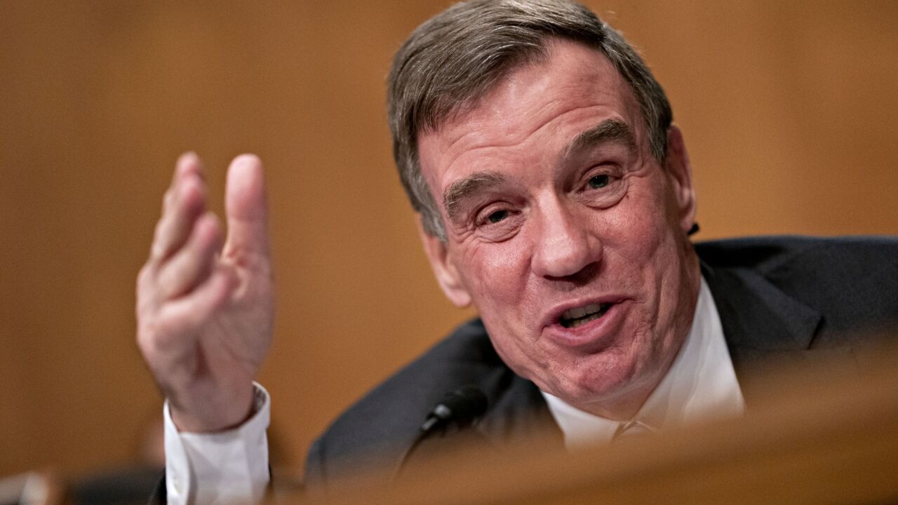 "We've created this cliff effect" on who is eligible, said Sen. Mark Warner, D-Va., adding that he shares concerns of others about how long it is taking the Fed to launch the Main Street program.