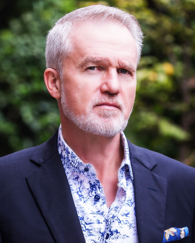 A photo of a man with a gray beard.