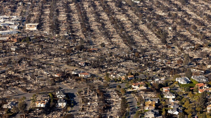 Aerial view of neighborhood devastated in Palisades Fire