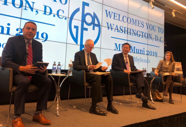 Panelists at a Government Finance Officers Association conference discuss SEC Chair Jay Clayton's comments on disclosure. From left to right, Oklahoma City Finance Director Kenton Tsoodle, Partner at Hawkins, Delafield & Wood LLP John McNally, Municipal Securities Rulemaking Board Chief Operating Officer Mark Kim and Director of the SEC's Office of Municipal Securities Rebecca Olsen.