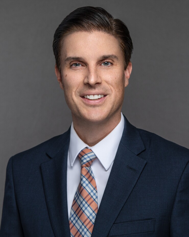 Adam Goode Schneider Downs