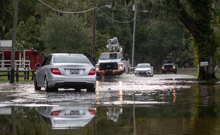 Cars navigate a flooded street after Hurricane Idalia hit Crystal River, Florida, last week.