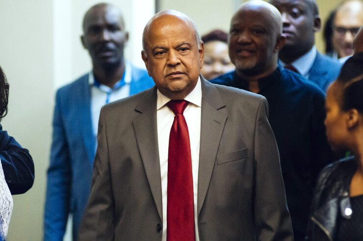 Pravin Gordhan, former South African finance minister, arrives for a news conference in Pretoria.