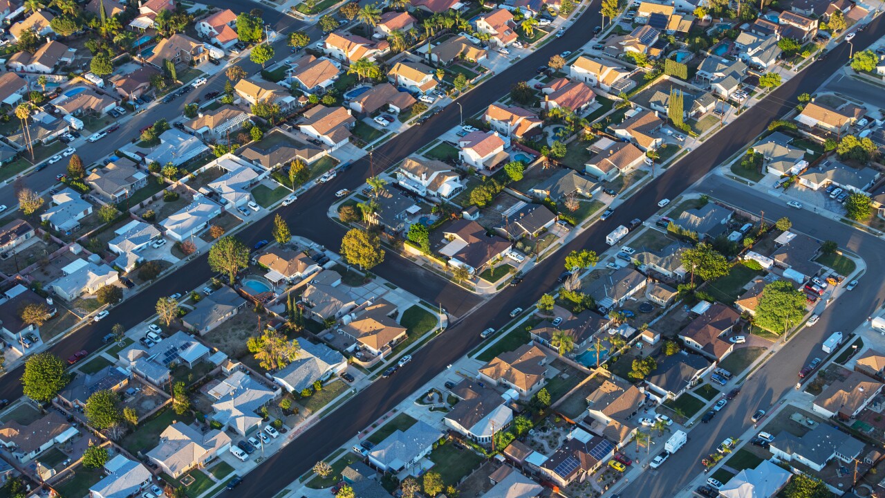Late afternoon aerial view of suburban neighborhood streets and homes near Los Angeles in Simi Valley, California.