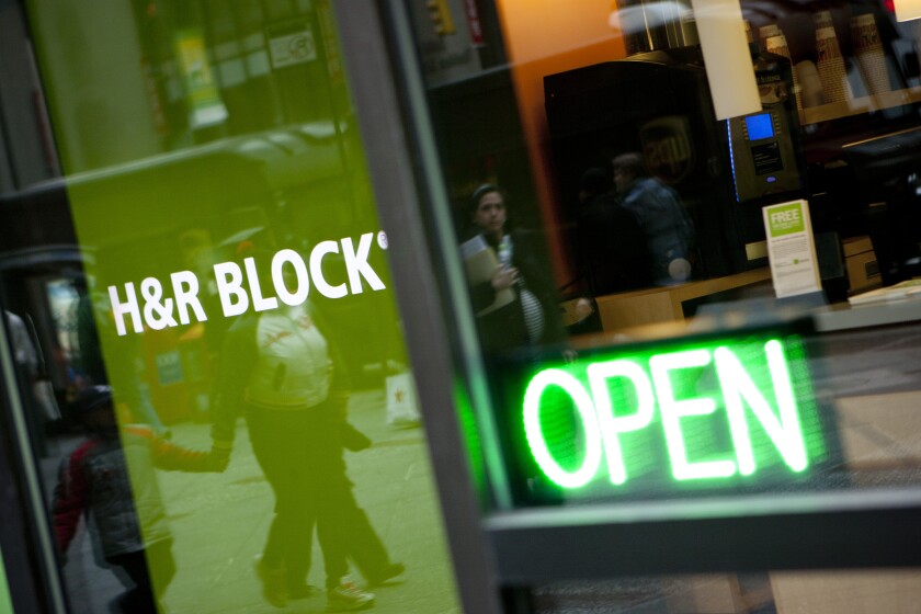 The H&R Block, Inc. logo is displayed in front of the company's flagship office in New York, U.S., on Friday, March 3, 2012. H&R Block, Inc. provides tax services to the general public, accounting and consulting services, and consumer financial and personal productivity software. Photographer: Scott Eells/Bloomberg