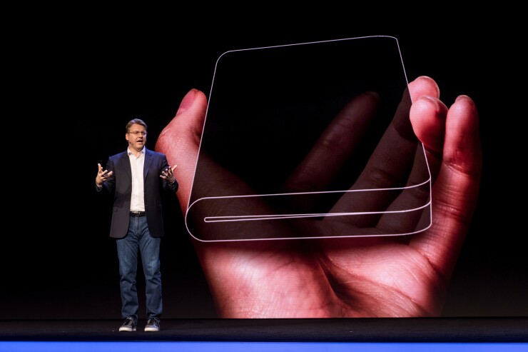 Justin Denison, senior vice president of product strategy and marketing for Samsung Electronics America, shows off a new phone with a foldable screen during the Samsung Developers Conference in San Francisco in early November 2018.